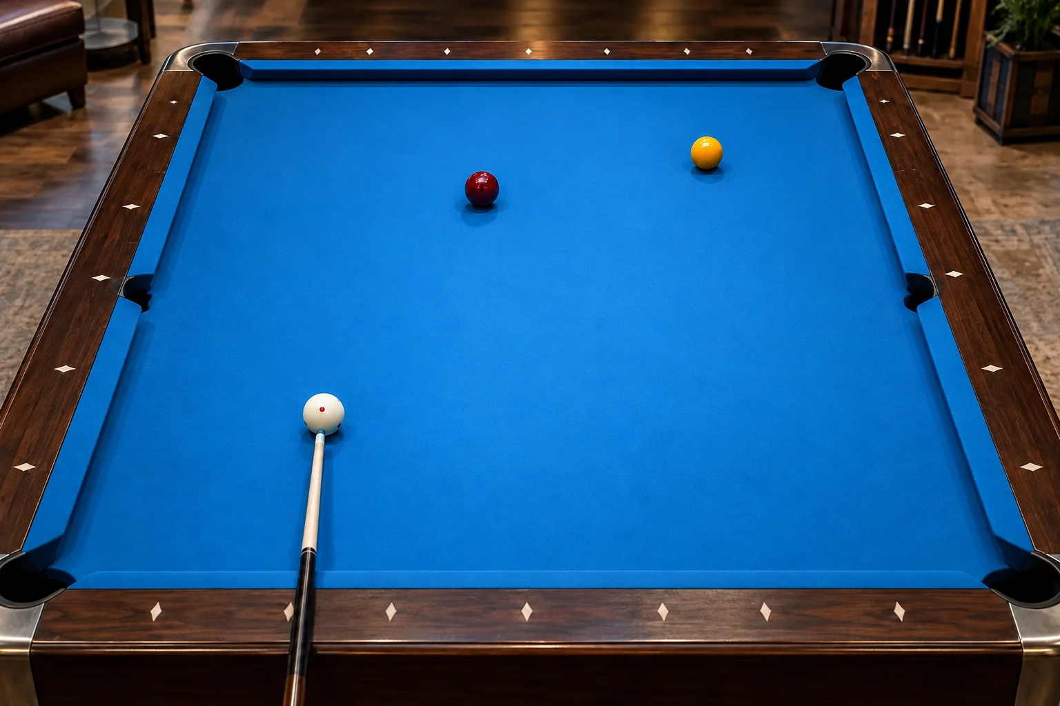 Unmarked pool table with one white cue ball, a cue and two ordinary object balls