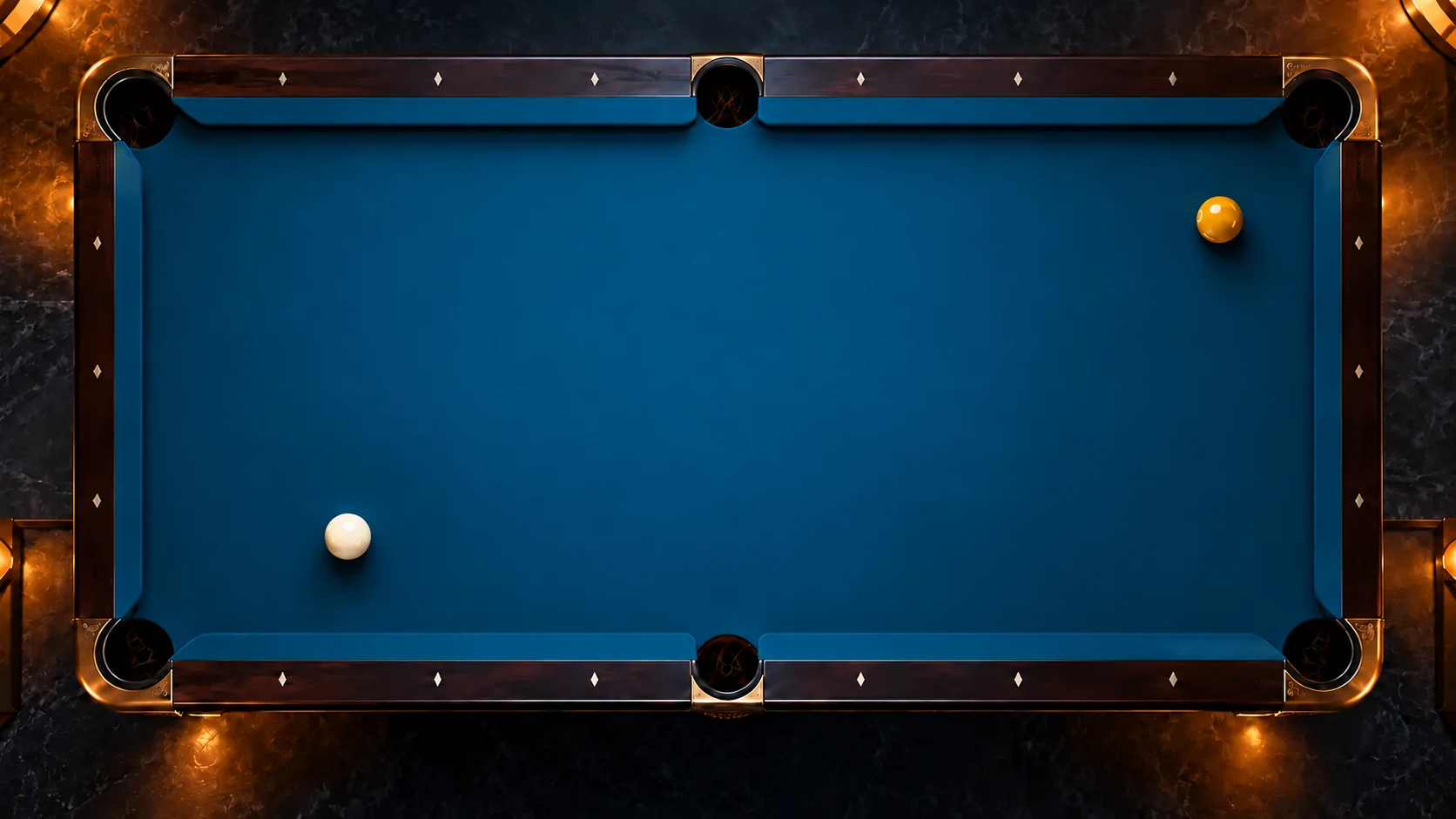One white cue ball and one yellow object ball resting on blue pool cloth, without a drawn trajectory