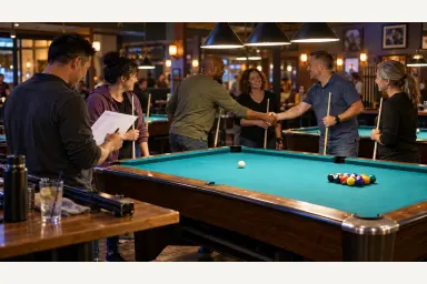 Community pool league players greeting opponents while a teammate checks a match sheet beside a prepared table